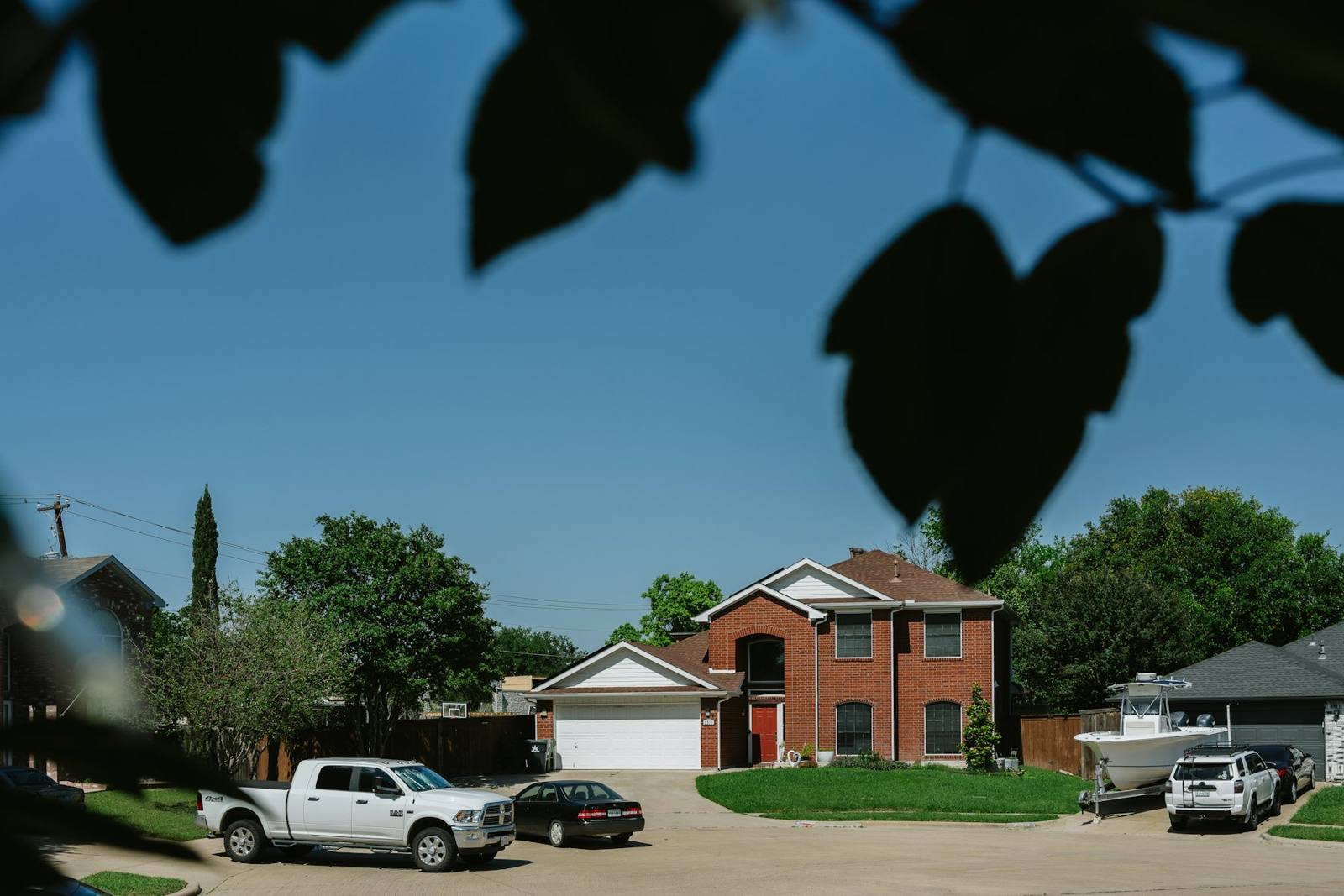 Brick family home on a sunny street