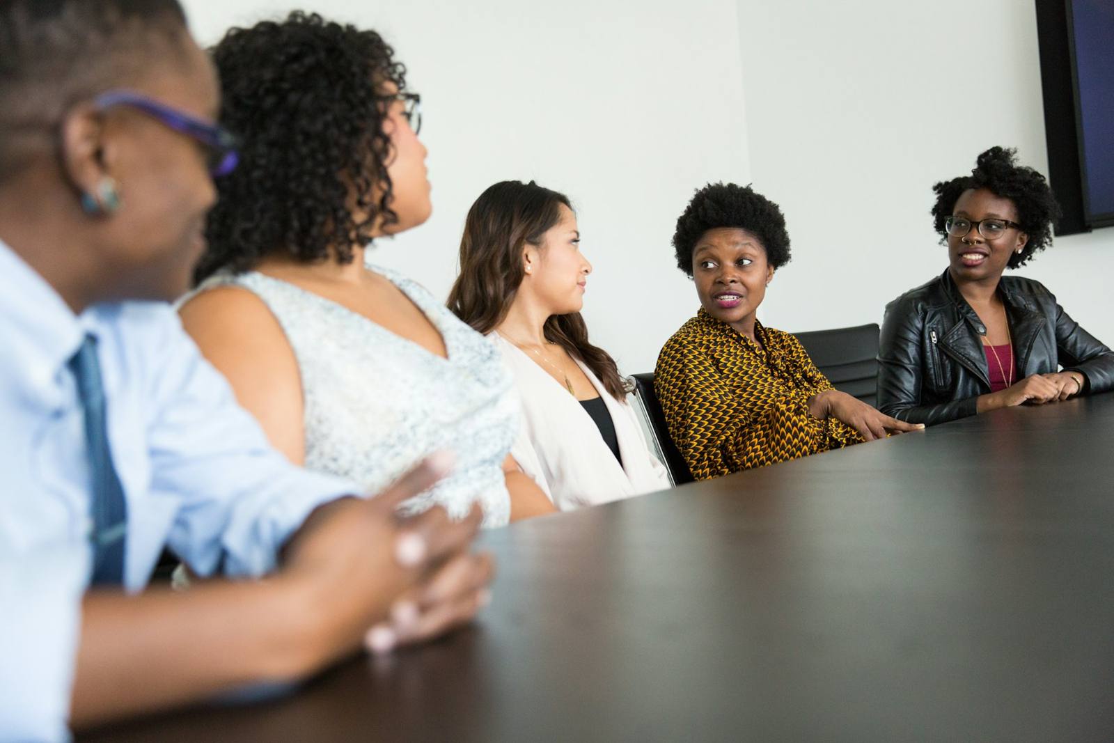Smiling team member in a group discussion