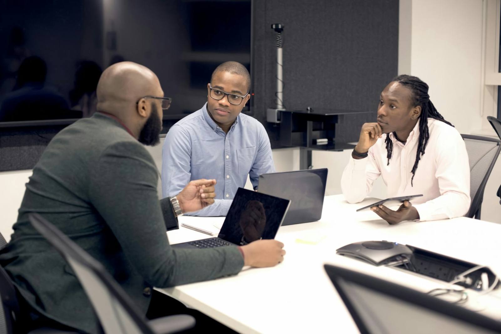 Leaders reviewing plans at a desk