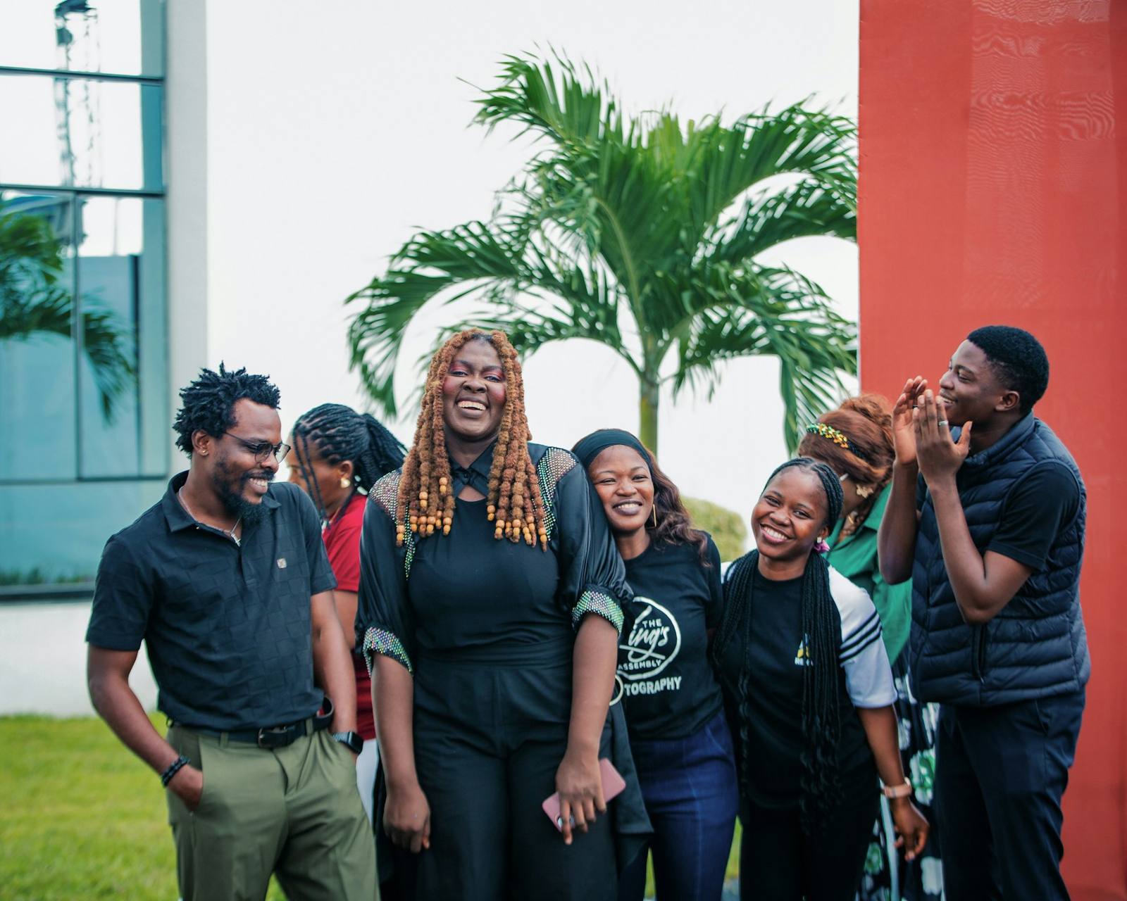 Diverse team laughing together outdoors