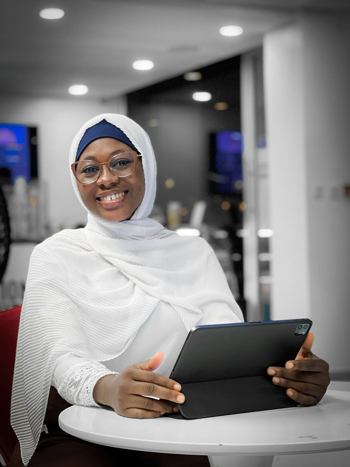 Professional woman smiling with a tablet